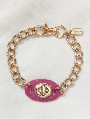 Coach Gold Pink Turn Lock Bracelet